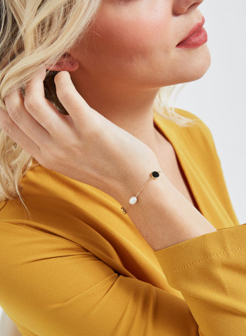 18 Karat Gold Black Onyx And Pearl Three Stone Bracelet