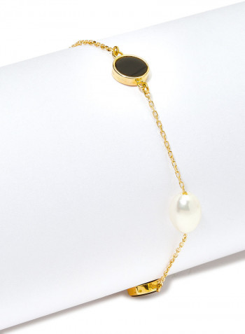 18 Karat Gold Black Onyx And Pearl Three Stone Bracelet